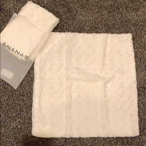 Two brand new fuzzy white pillowcases